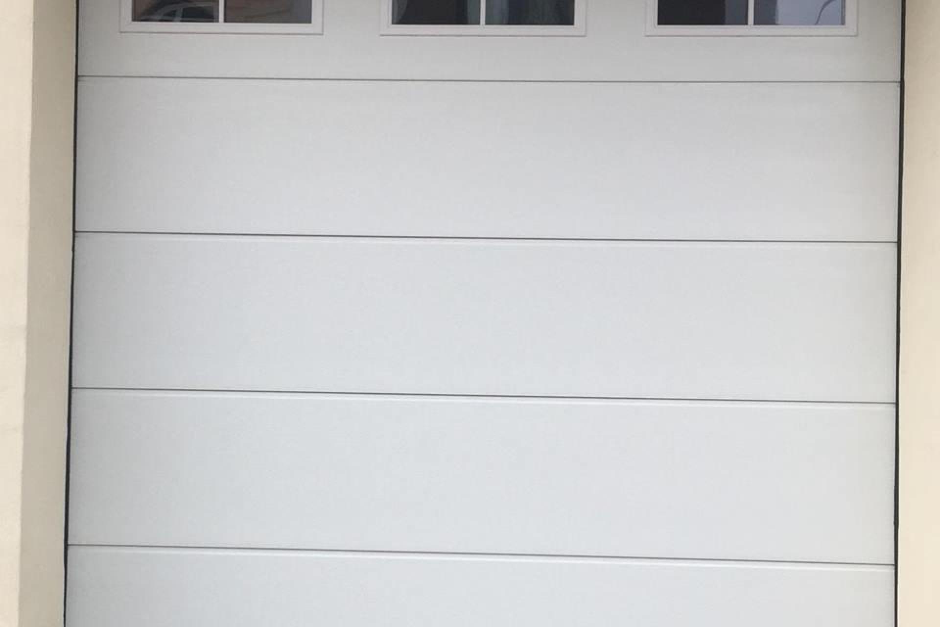 cross windows on top, garage doors Malta